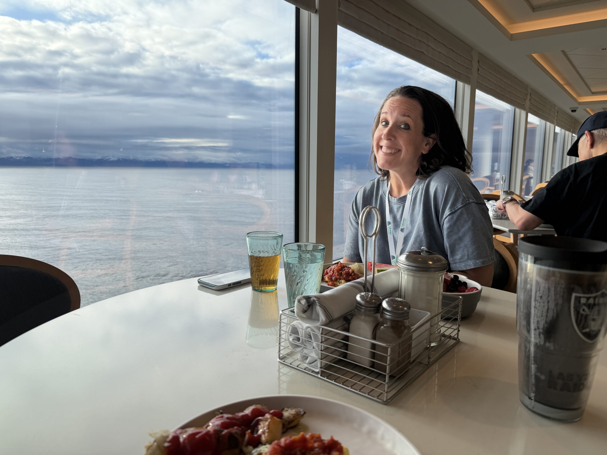 Expert travel agent, Katy Thompson of Gallivanters Vacations, enjoying breakfast on an NCL Alaskan Cruise.