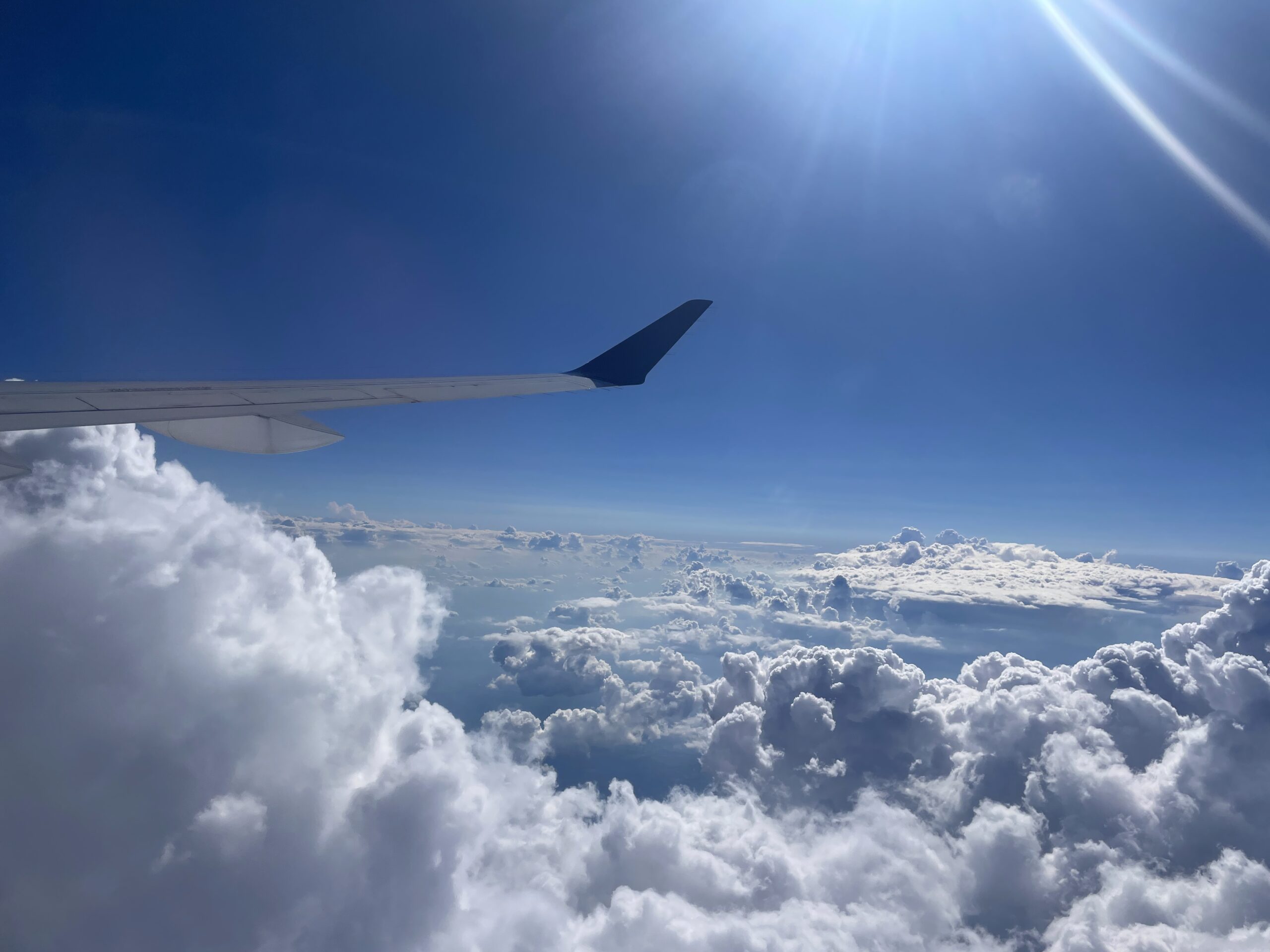 Beautiful white puffy clouds seen from a plane