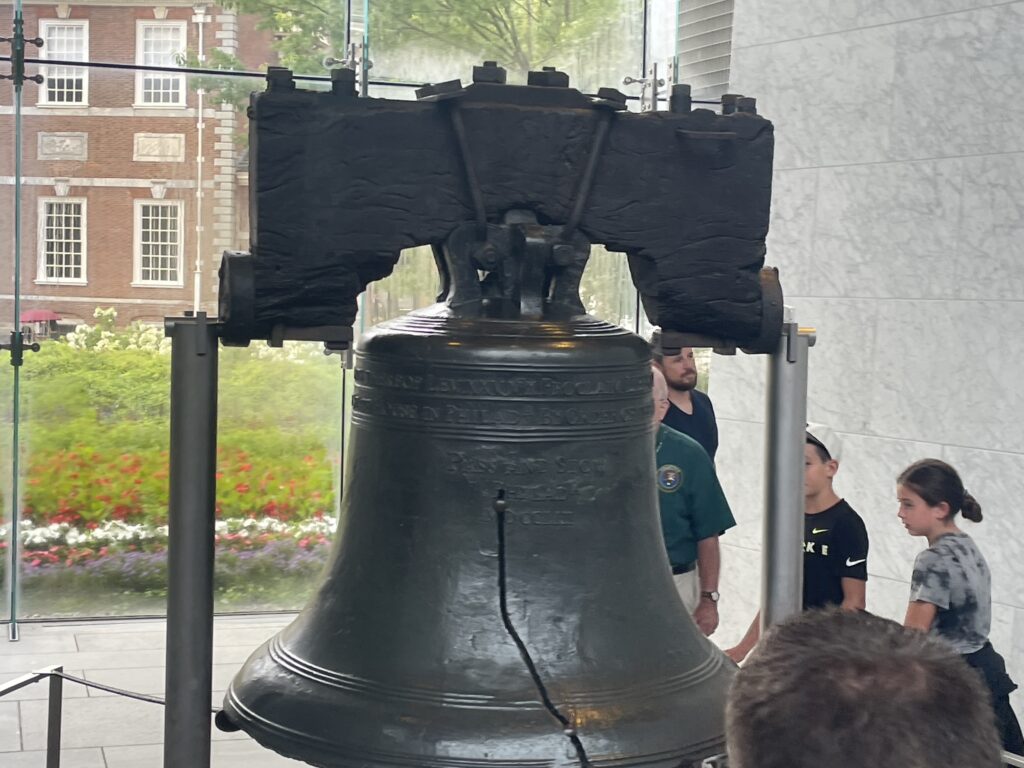 The historic Liberty Bell showing the famous crack, displayed at the Liberty Bell Center in Philadelphia.