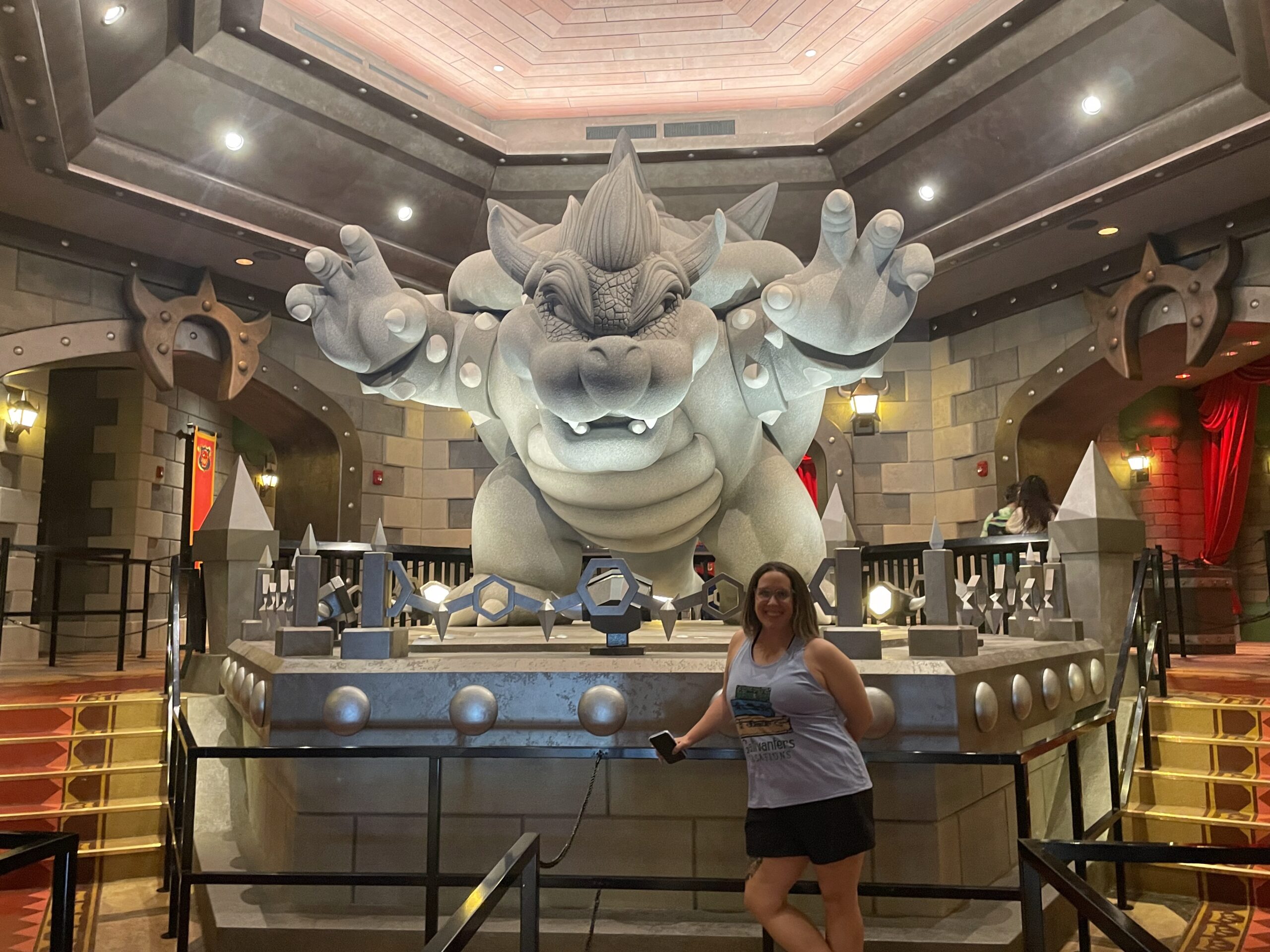 Professional travel advisor Katy Thompson scouting the Super Nintendo World queue at Epic Universe to provide clients with inclusive seating and fit tips for Mario Kart.