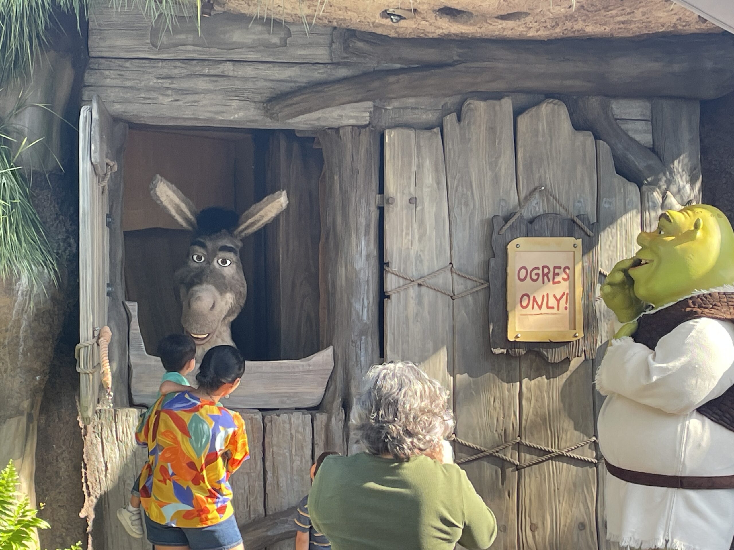 Shrek and Donkey greeting guests at their swamp in the new DreamWorks Land at Universal Studios Florida, a popular character meet and greet for families.