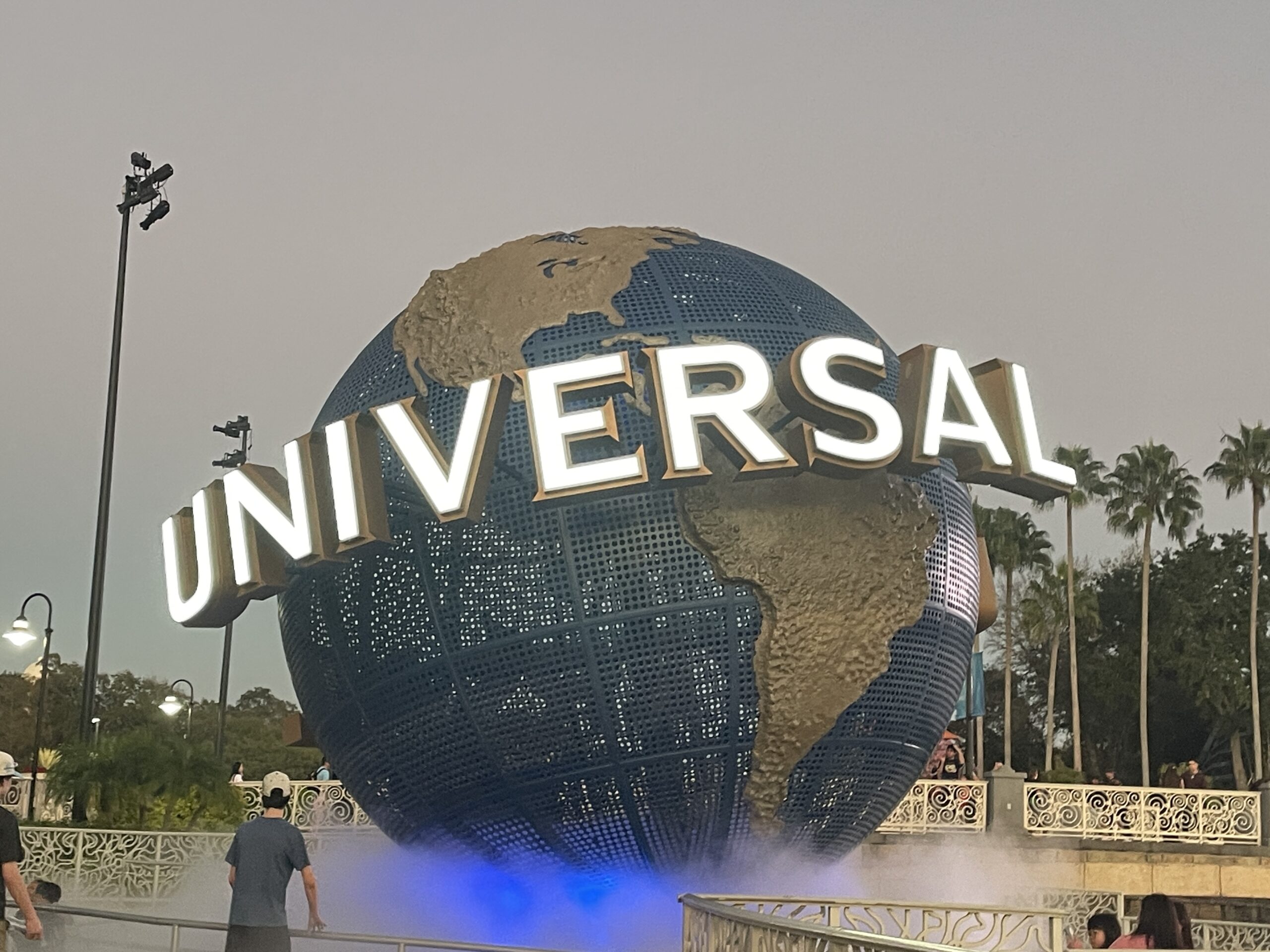 Universal Studios Florida globe at night, representing the expert on-site research provided by Gallivanters Vacations for Epic Universe and Islands of Adventure trips.