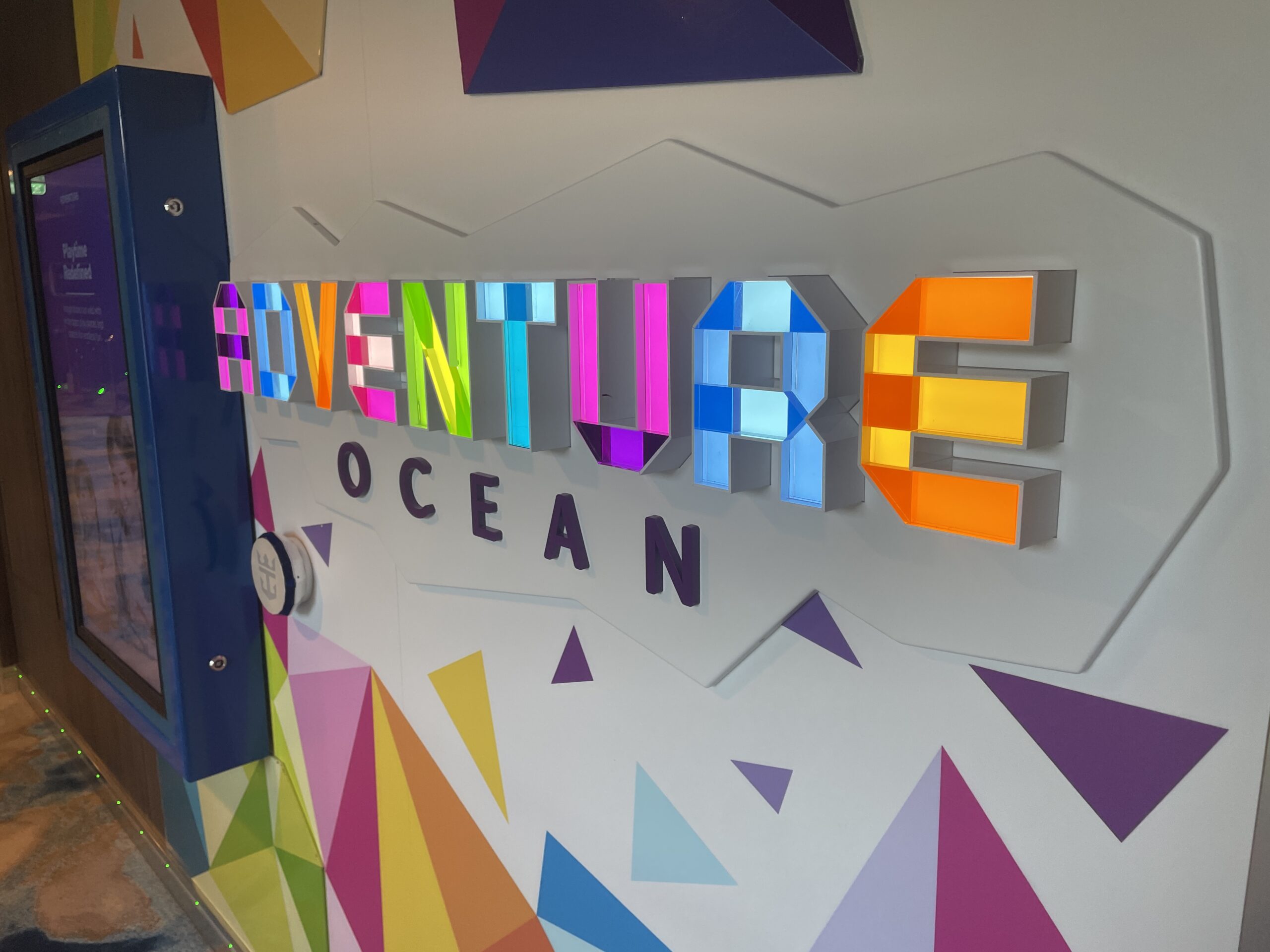 The modern Adventure Ocean kids club on Wonder of the Seas, featuring interactive gaming stations and creative play areas for children.