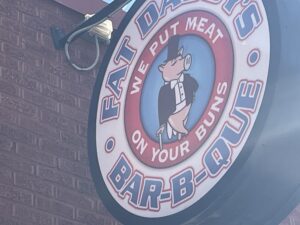 Exterior view of Fat Daddy's Bar-b-ue sign.