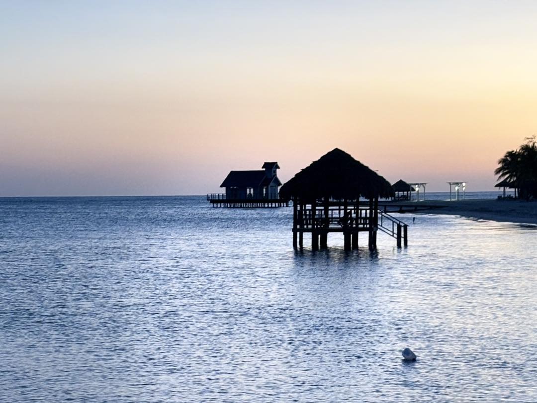 Sunset at an overwater bungalow at Sandals Southcoast